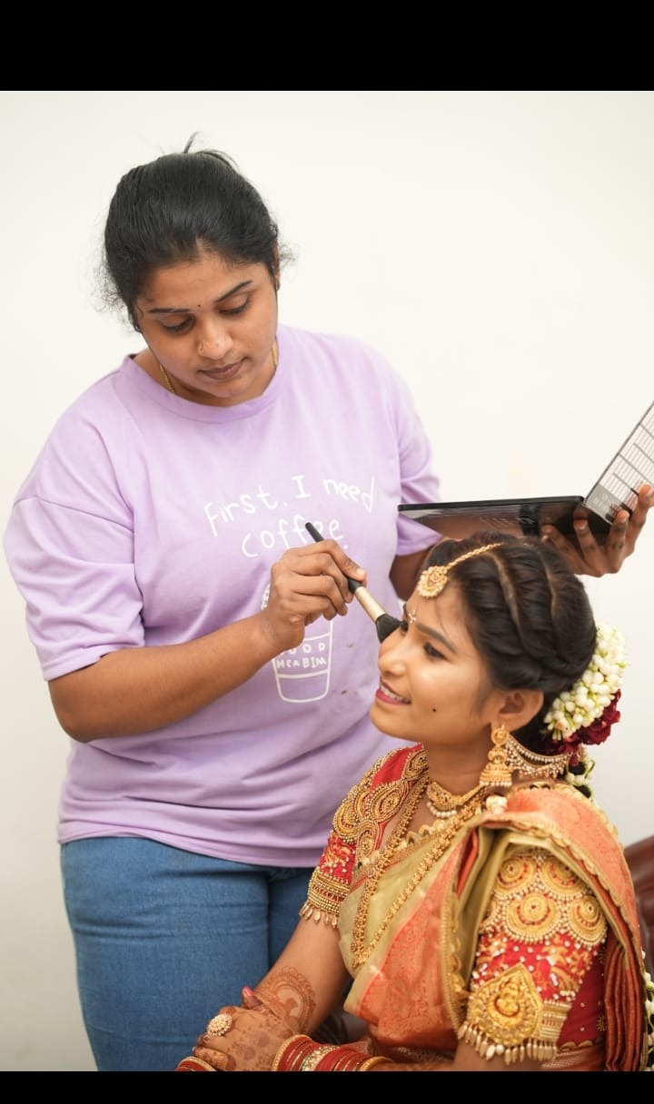 Indhu doing live bridal makeup on a Telugu bride